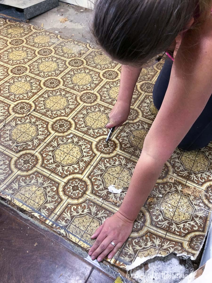 Cut the old linoleum with a utility knife into strips to make it easier to remove. 