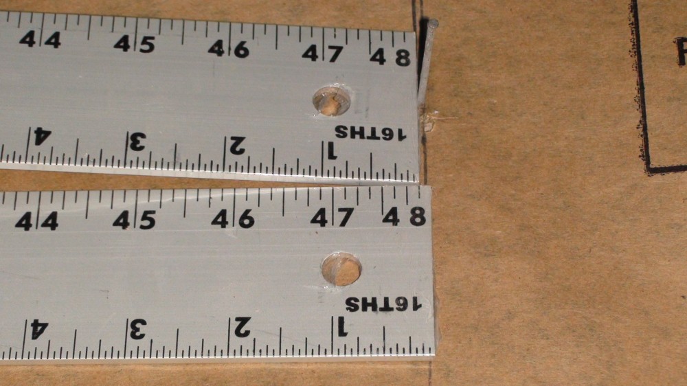 Small horizontal movements can result in exponentially larger vertical movements. When one end of a ruler is restrained and the other end moved toward the center 3.2 mm (1/8 in.), there is a 51-mm (2-in.) rise at its apex. Photos courtesy Ceramic Tile and Stone Consultants