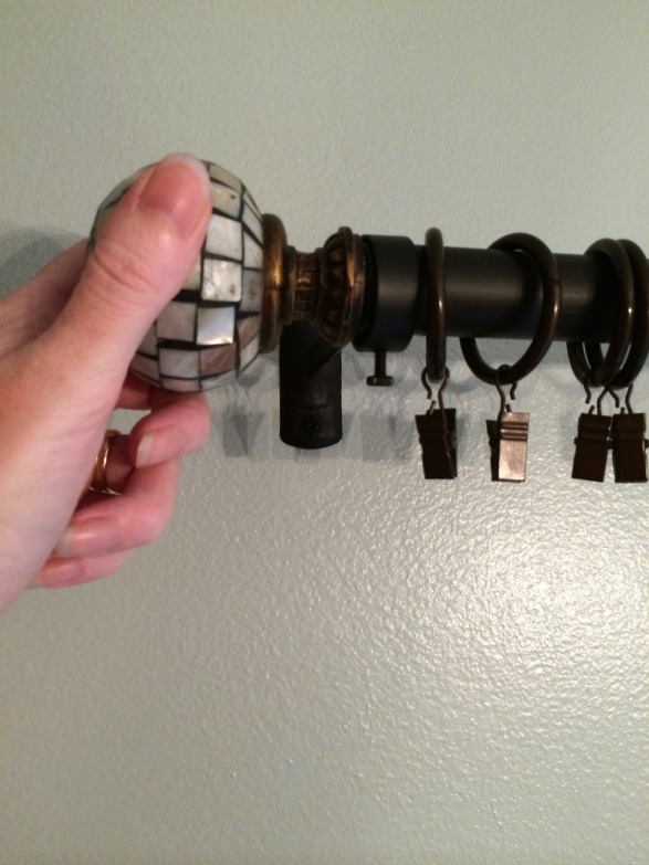 Secure finial on end of curtain rod